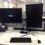 Double monitor with moveable arms