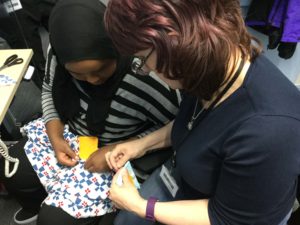 Patchwork class run by Michele - here showing a student how to start off